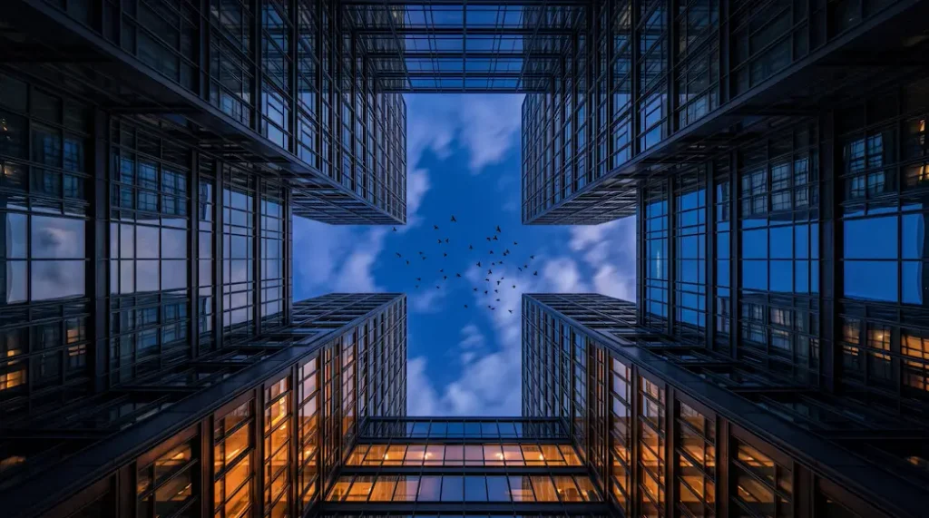 Looking up at European institutional buildings at dusk, representing EU flooring regulation direction