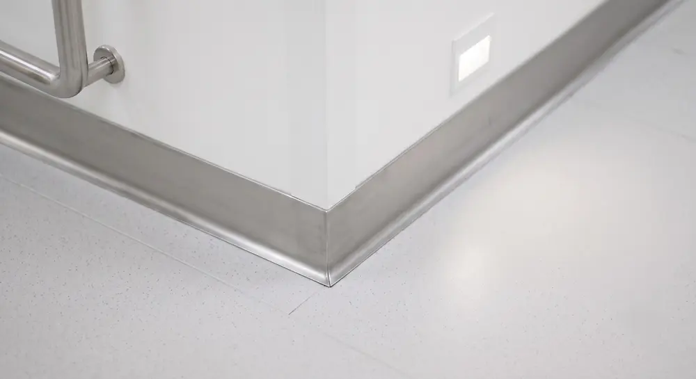 close-up of seamless cove base flooring detail in clinical setting