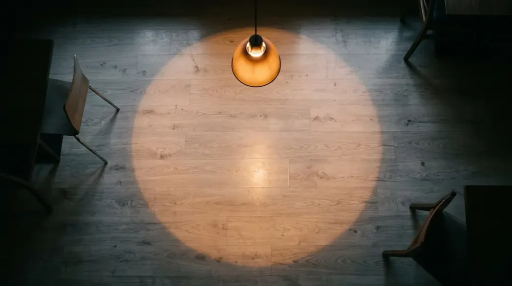 Commercial dining space with high-density laminate flooring under dramatic evening lighting